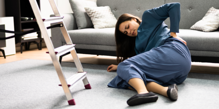 woman falling off of ladder